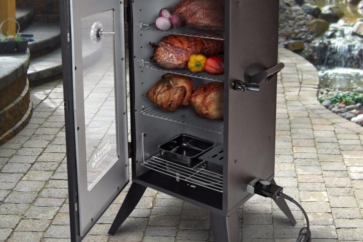 Electric Smoker with meat inside and fruits